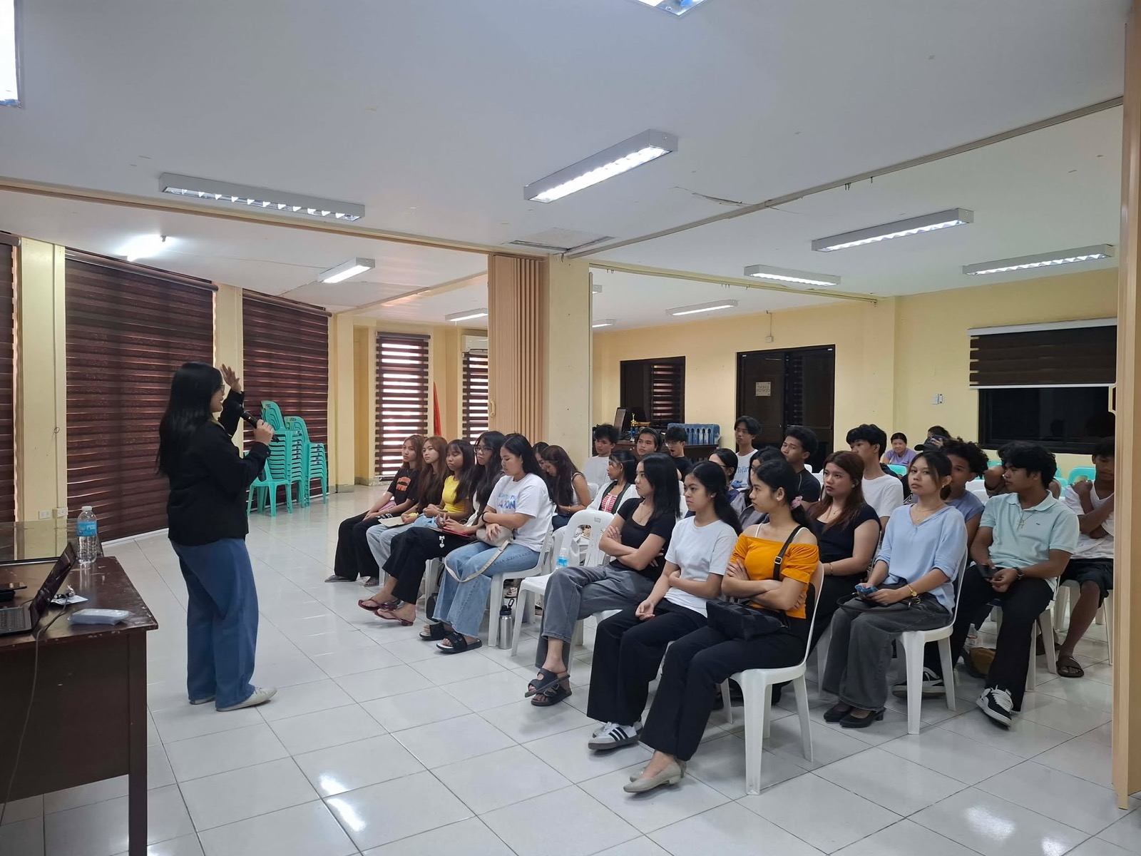 Facilitator speaking to youth participants during a formation session